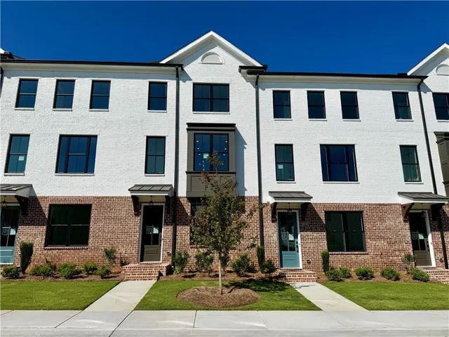 Brick and white facade with black-framed windows