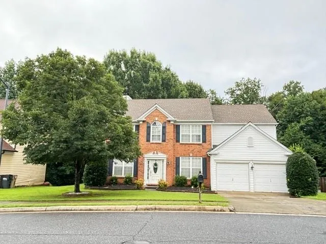 Brick and siding exterior with a two-car garage