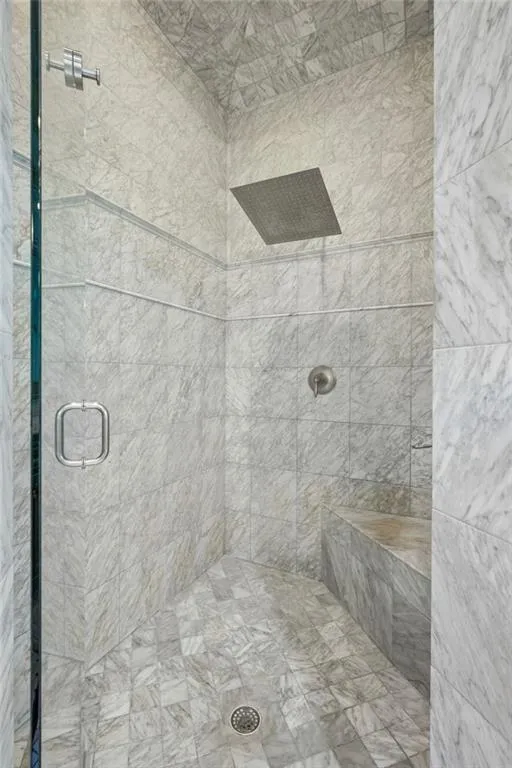 Floor-to-ceiling marble shower.