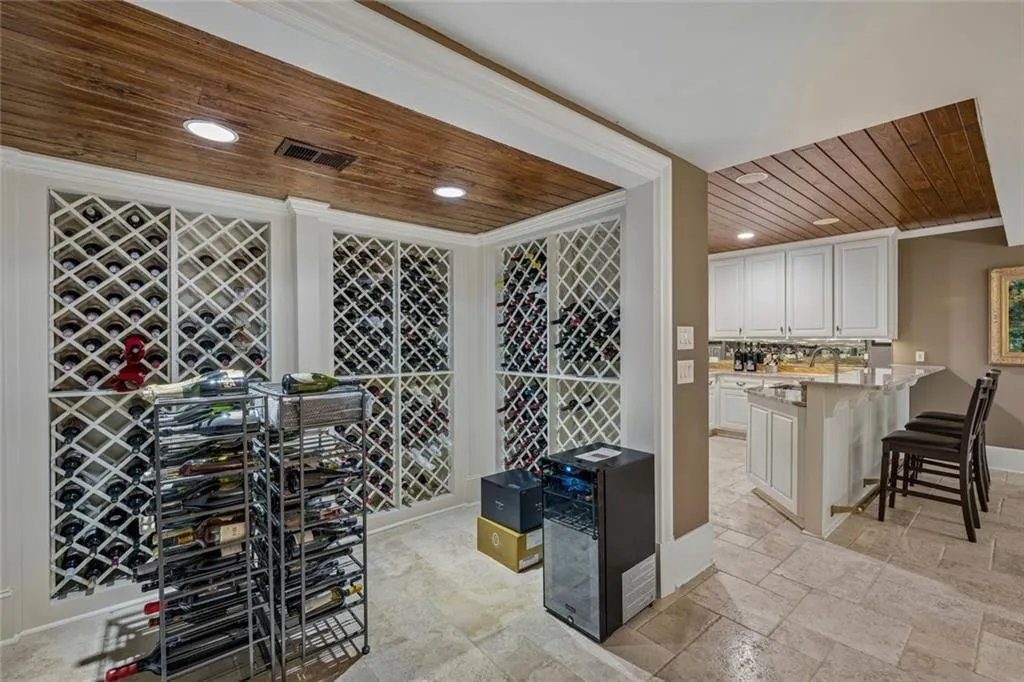 The wine cellar flows directly into the wet bar.