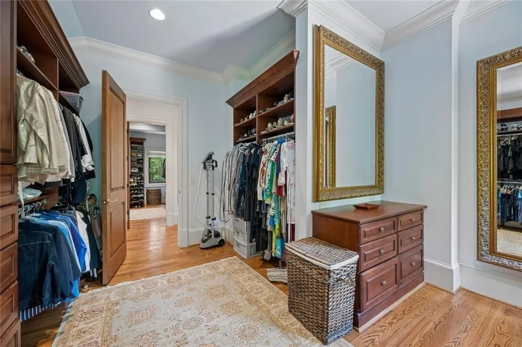 Hers  custom designed walk-in closet.