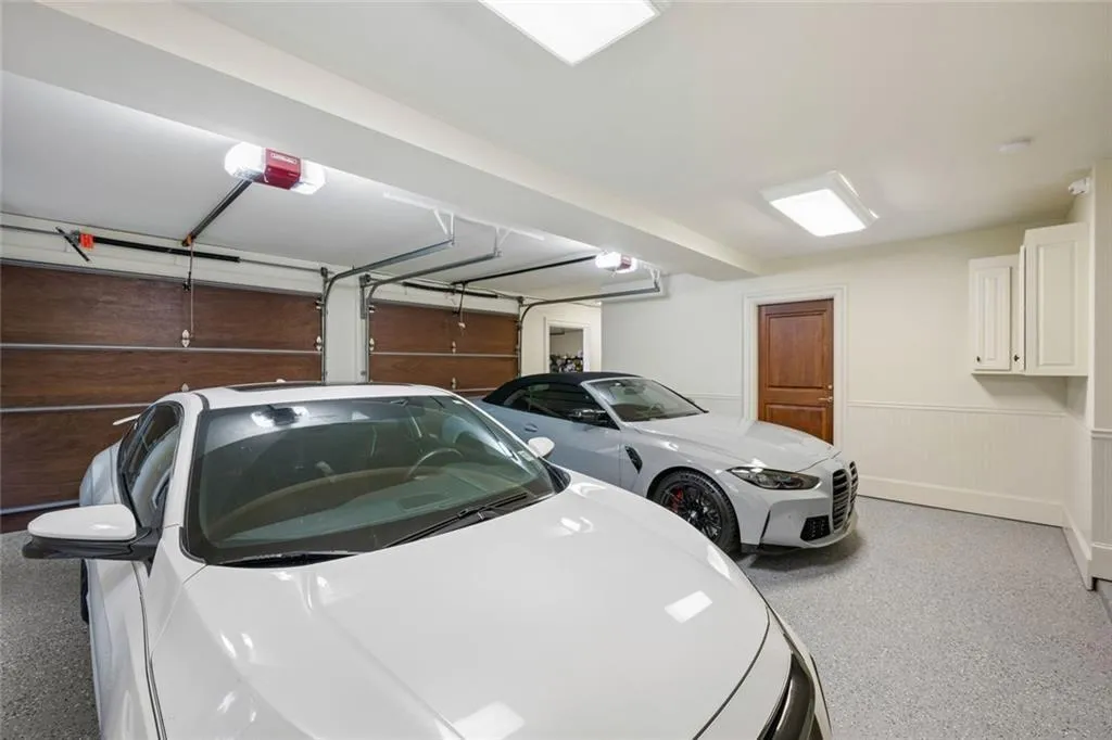 Extra large four car garage offering exceptional space for vehicles and storage.