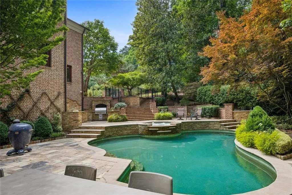Walk out from the kitchen balcony above or straight through the terrace level to a sparkling pool.