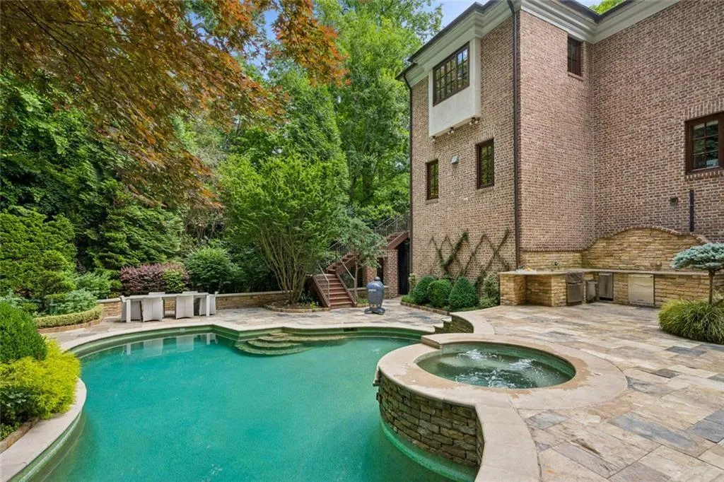 Tucked away in a canopy of mature trees and lush gardens.