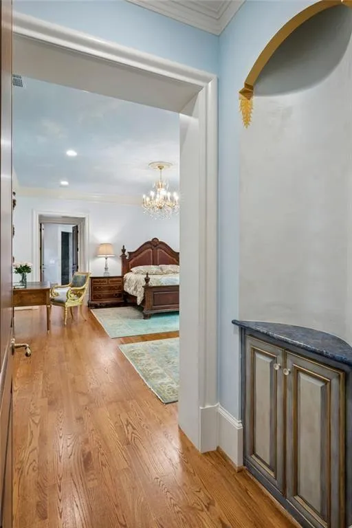 The primary suite awaits with soaring ceilings.