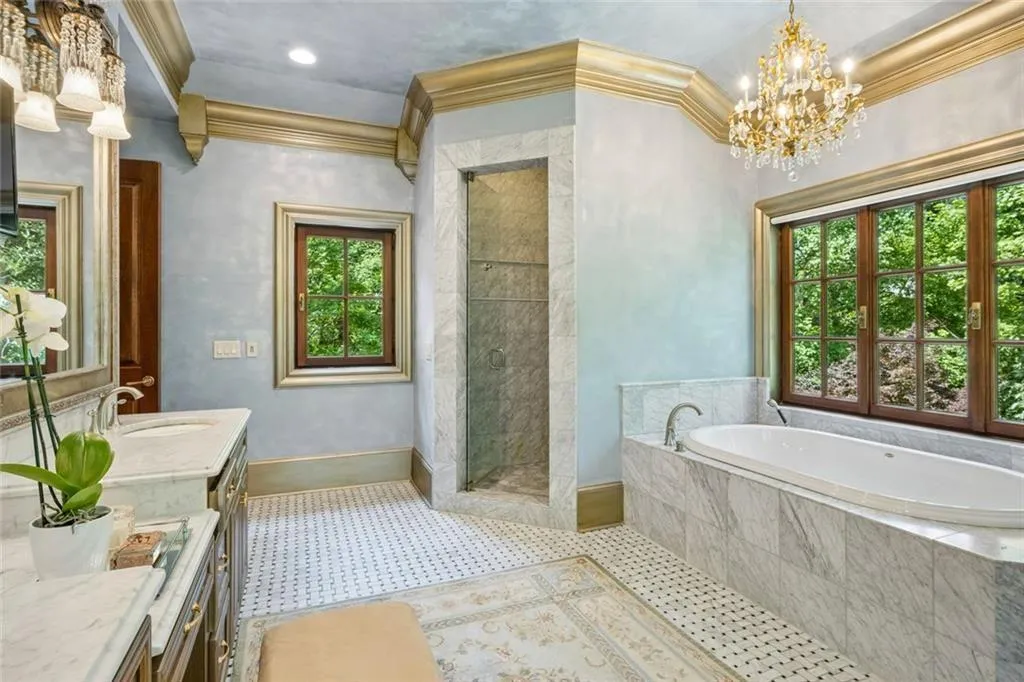 Soaking Jacuzzi tub, separate marble shower.