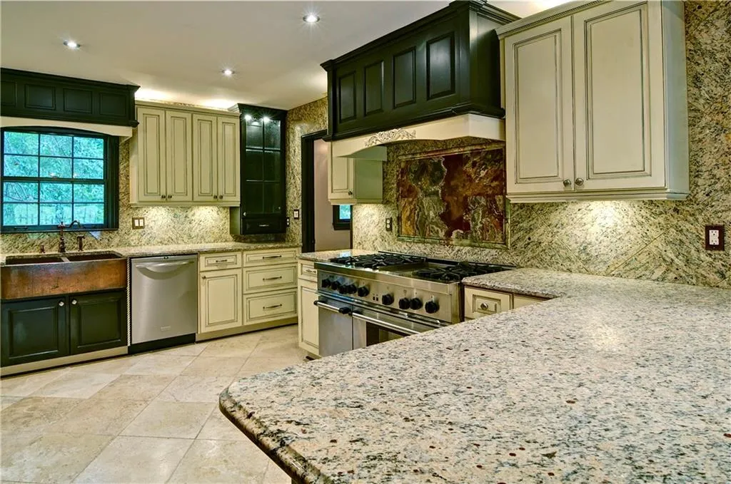 This kitchen offers plenty of cabinet space with additional space in the laundry room if needed.  The laundry room is just off the kitchen and also offers a garage entrance