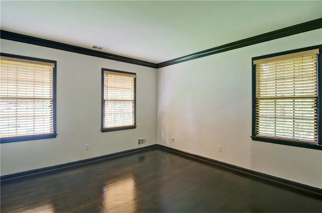 Bedroom #3 with crown molding and hardwood floors