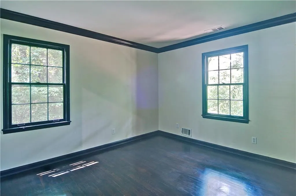 Bedroom #4 also offers crown molding and hardwood floors