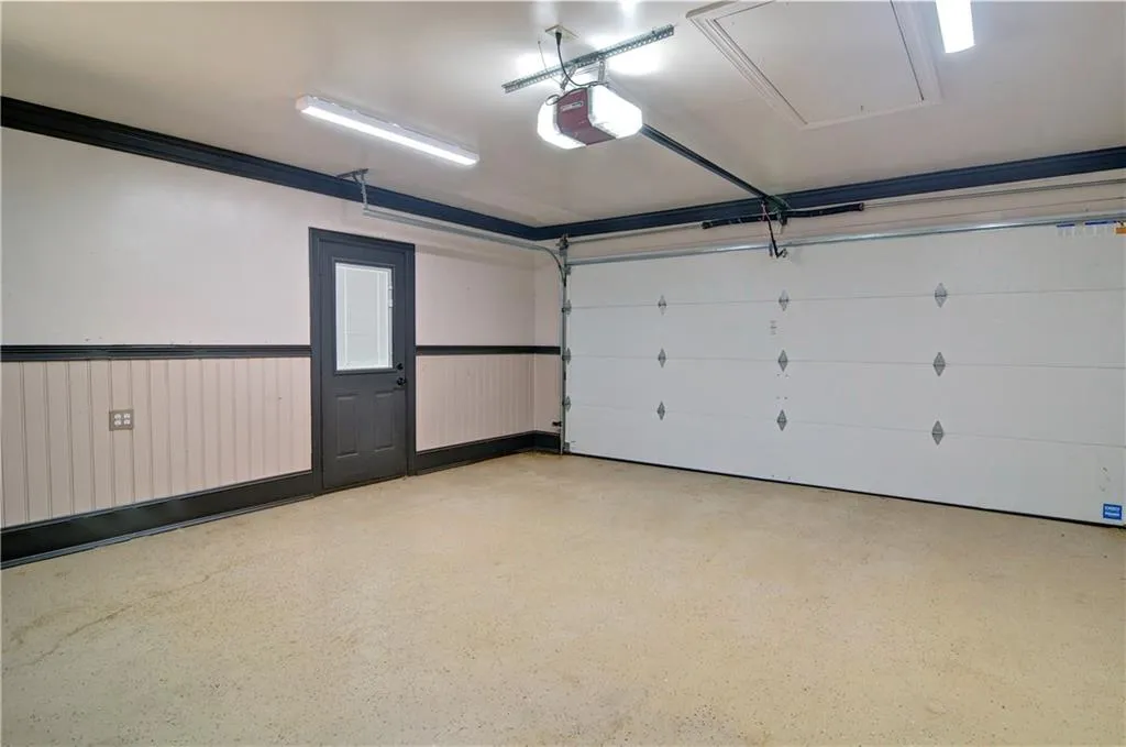 Very large tow car garage located on main level just off the laundry room