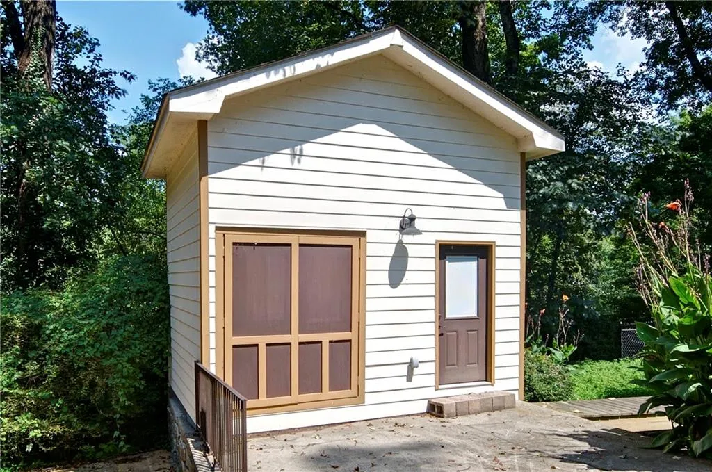 This separate building has so many possibilities.  Do you need extra storage space, an office, a studio, playhouse?