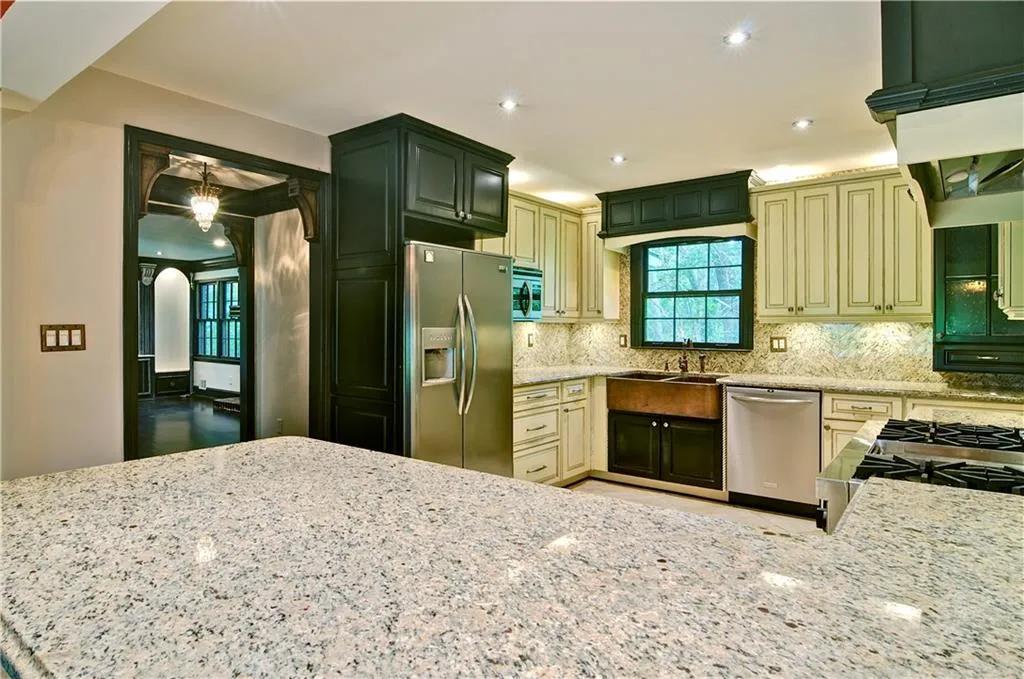 Tons of granite counter top space will make cooking in this kitchen a delight