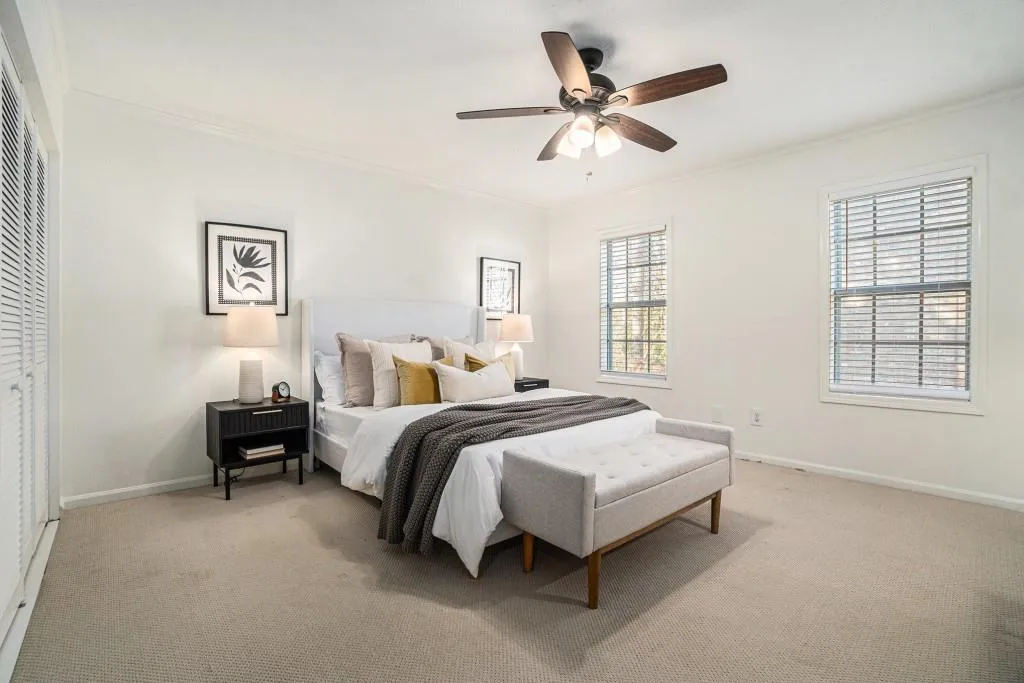 Upstairs, you'll find a serene Primary Suite with Two Closets and a beautifully updated Ensuite Bathroom featuring a Stone Vanity and a Sleek Glass Shower.