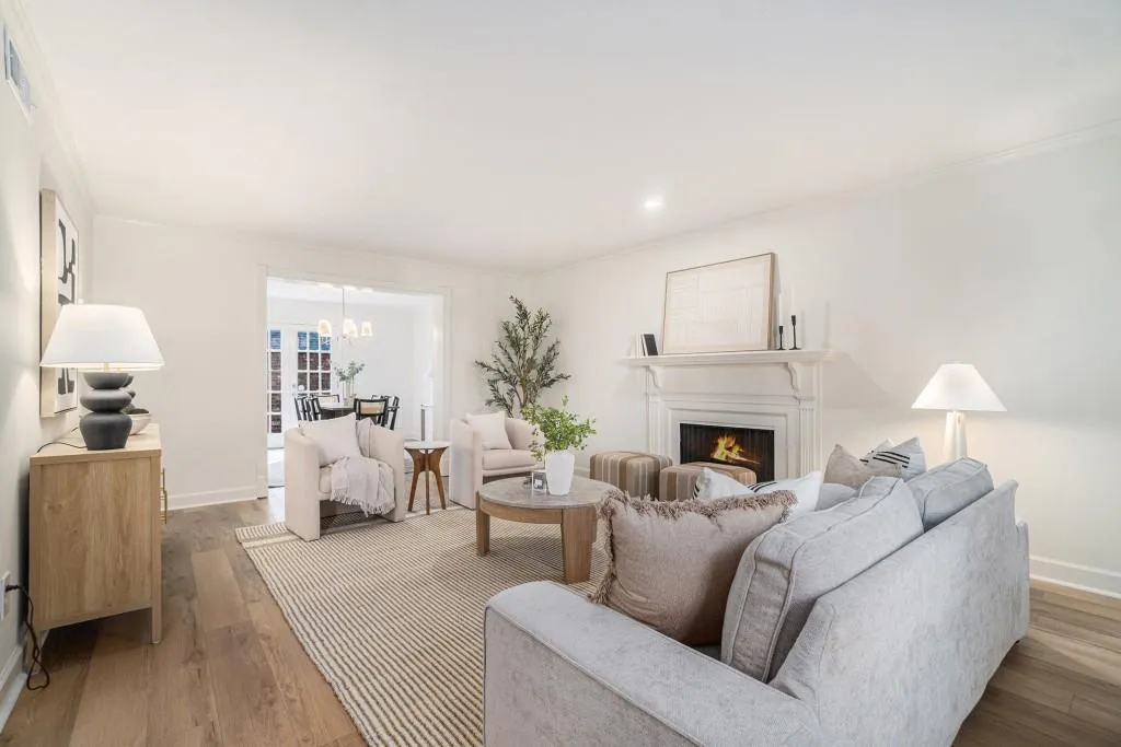 The Fireside Family Room offers generous space for everyday living, anchored by a classic mantel and surrounded by crisp white walls that keep the whole home feeling Light and Airy.