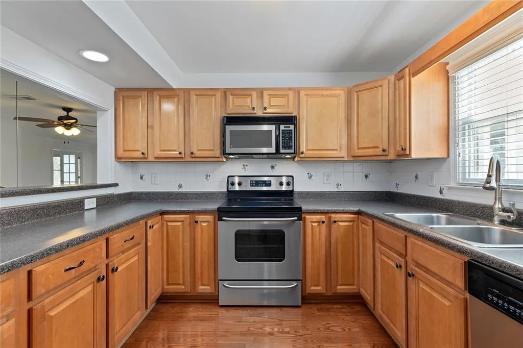 stainless appliances in u shaped kitchen