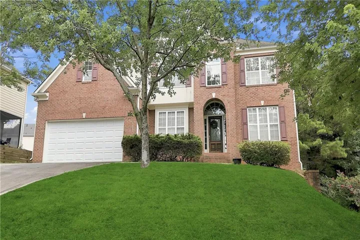Brick exterior with white trim and brown shutters