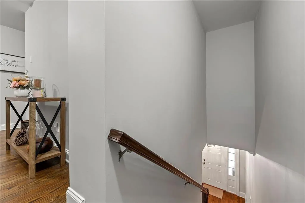 Stairs featuring hardwood / wood-style floors