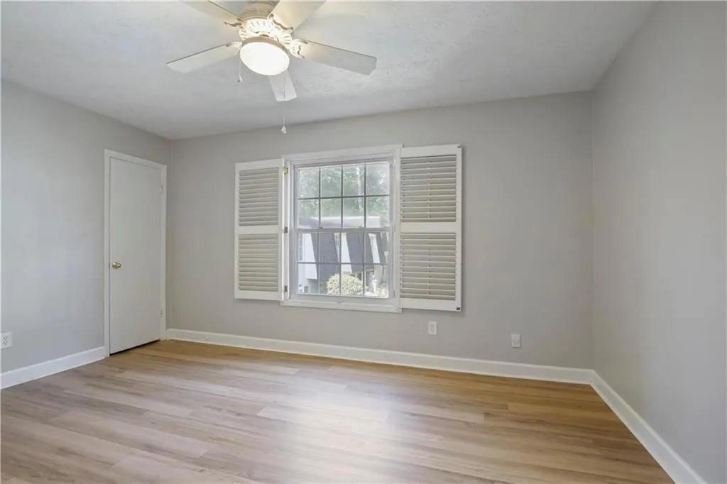 Primary bedroom with olantation shutters