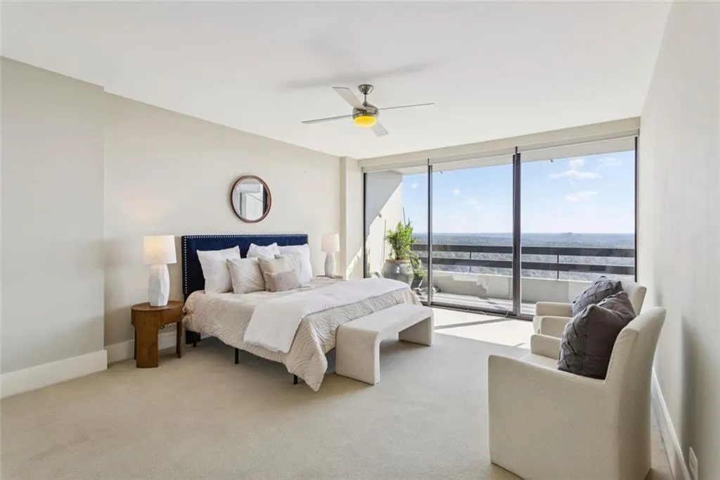 Light filled king size Primary Bedroom with sitting area.