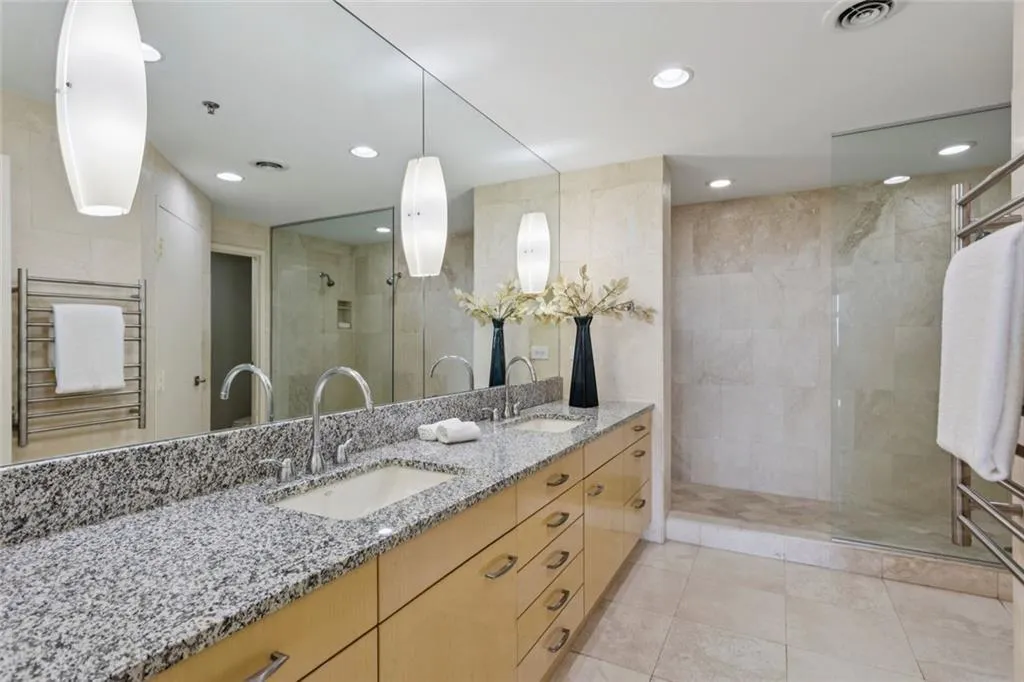 Double vanity with soft close drawer cabinets in the primary bath with large walk in closet.