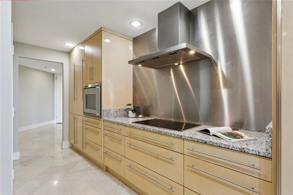 High end appliances include SubZero refrigerator, Gagganeau vent hood and microwave, Miele stove, and Bosch diswasher.