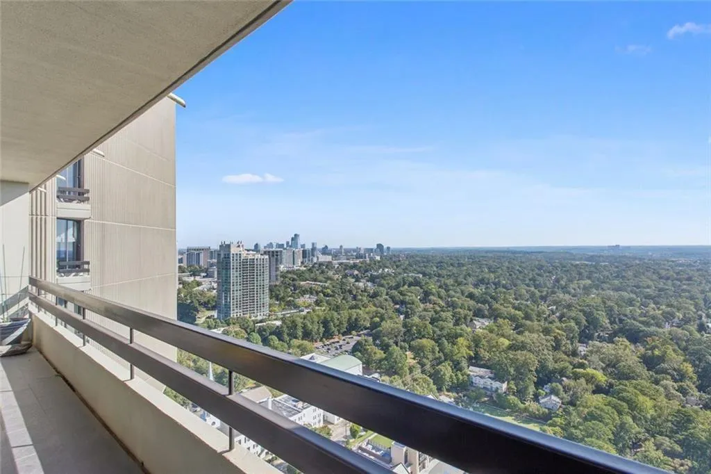 Dramatic views of the greenscape from balcony off the Primary Bedroom.