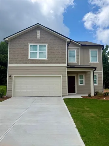 Two-story residence featuring a combination of horizontal siding and shake siding.
