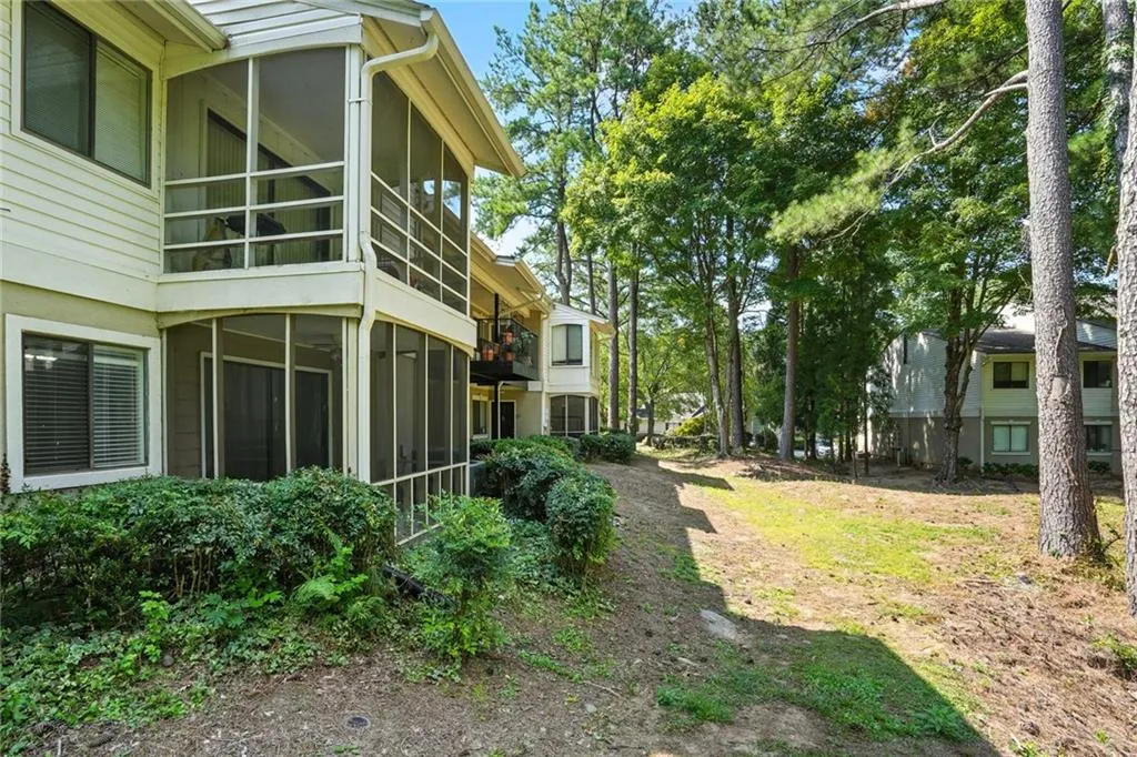 View of yard with a sunroom