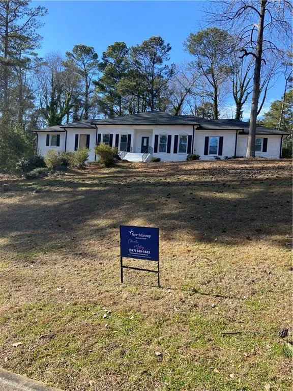 Ranch-style home with a front yard