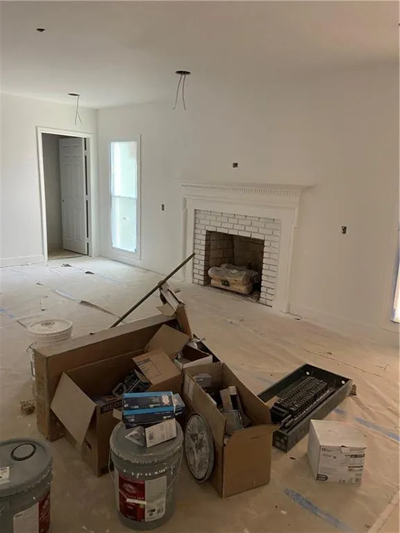 Living room with a fireplace and baseboards