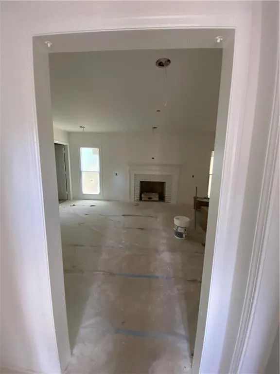 Empty room featuring plenty of natural light
