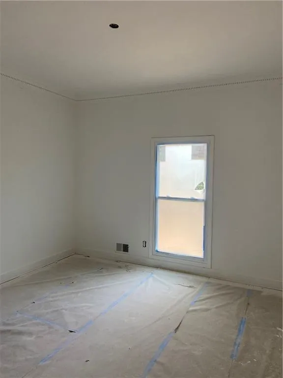 Unfurnished room featuring baseboards