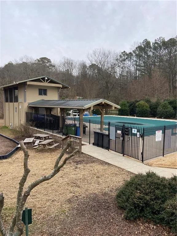Community pool with a patio