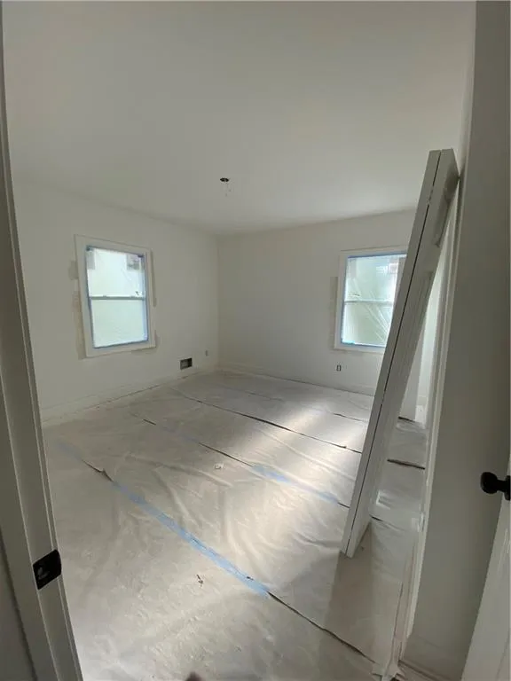 Doorway to garage featuring baseboards