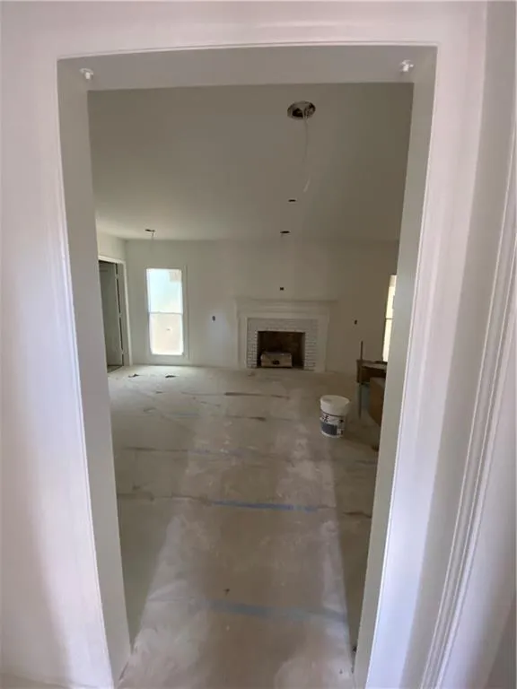 Unfurnished living room with a fireplace