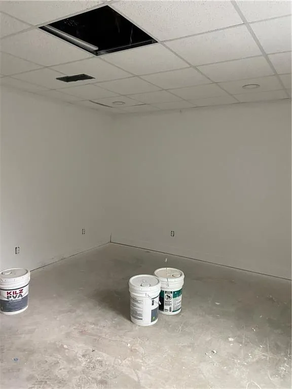 Basement with a paneled ceiling