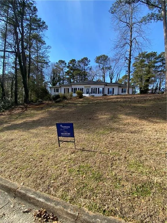 Single story home with a front yard