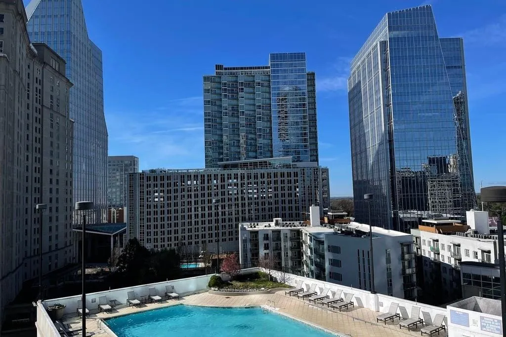 Community pool with a city view
