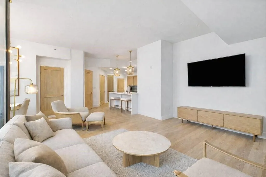 Living room featuring a chandelier and light wood-type flooring