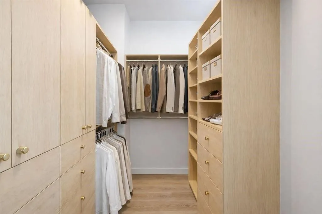 Walk in closet featuring light wood-type flooring