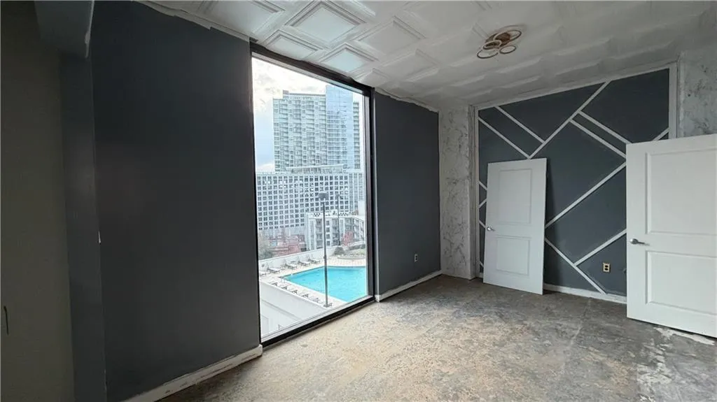Unfurnished bedroom featuring an ornate ceiling