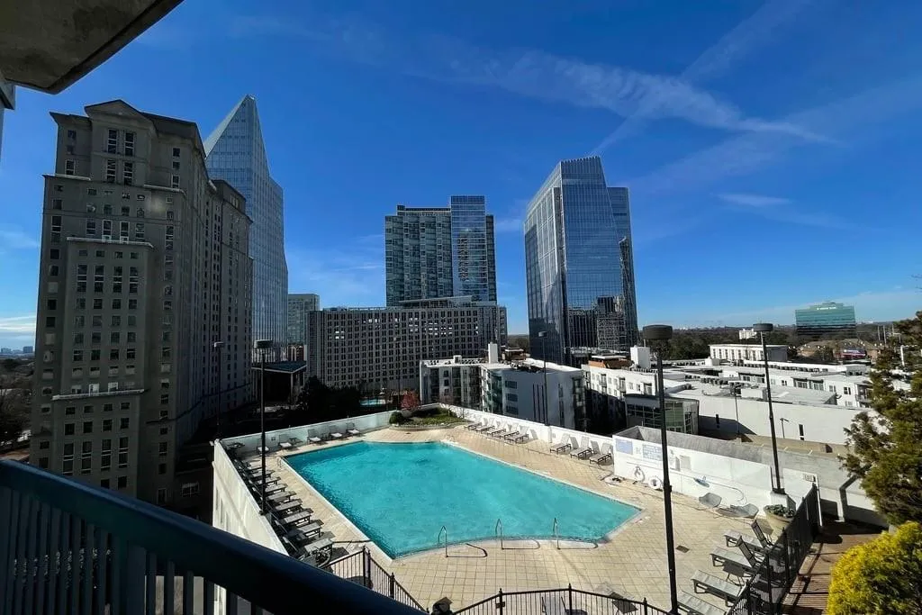 Community pool featuring a city view