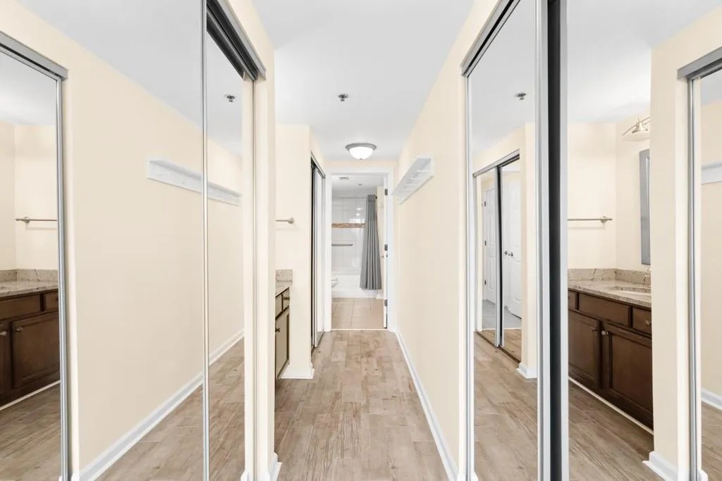 Hallway with light wood-style flooring