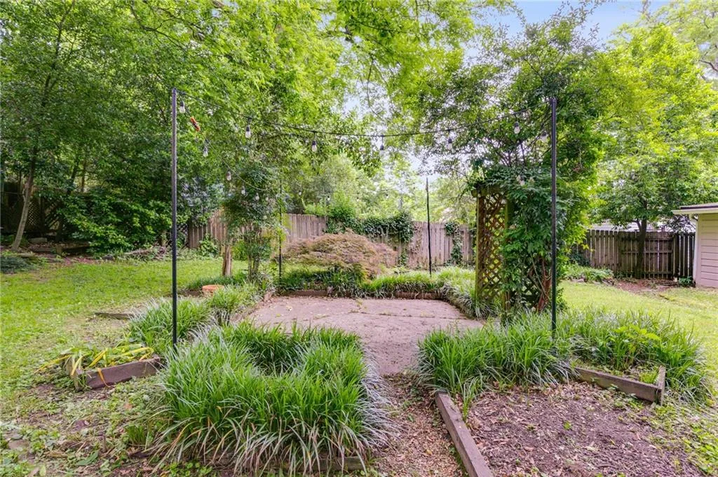 Fenced backyard with a garden