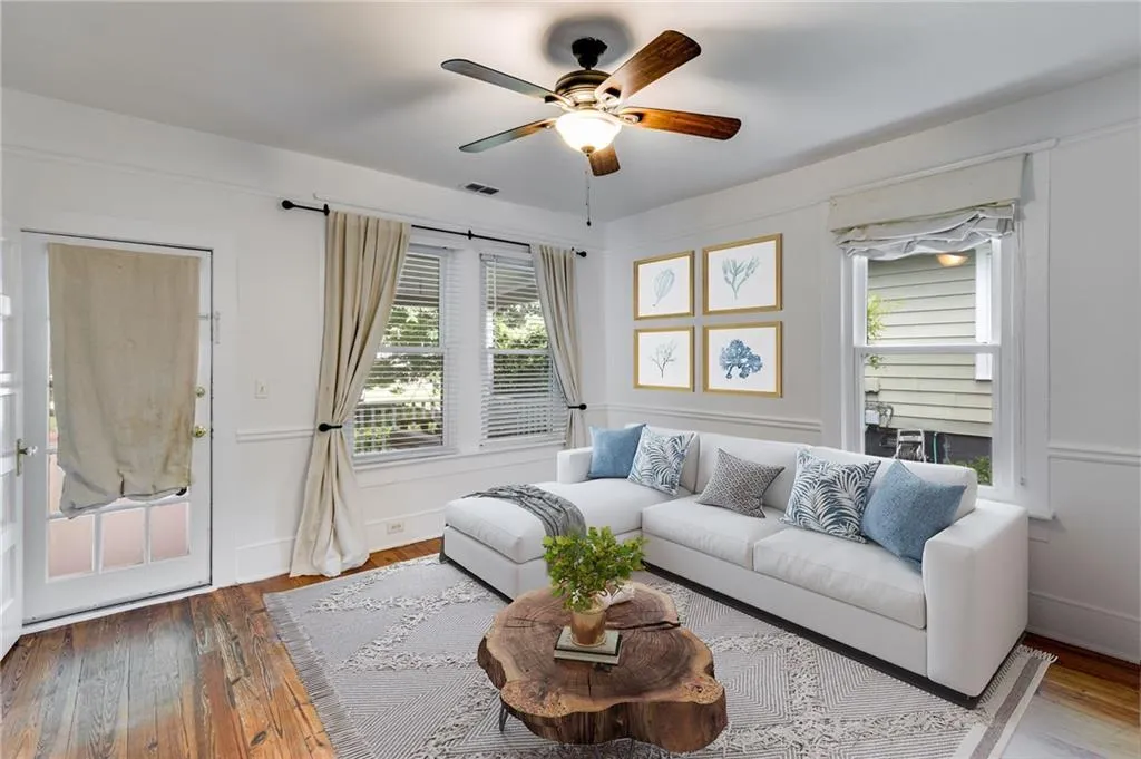Living area featuring hardwood / wood-style flooring and ceiling fan