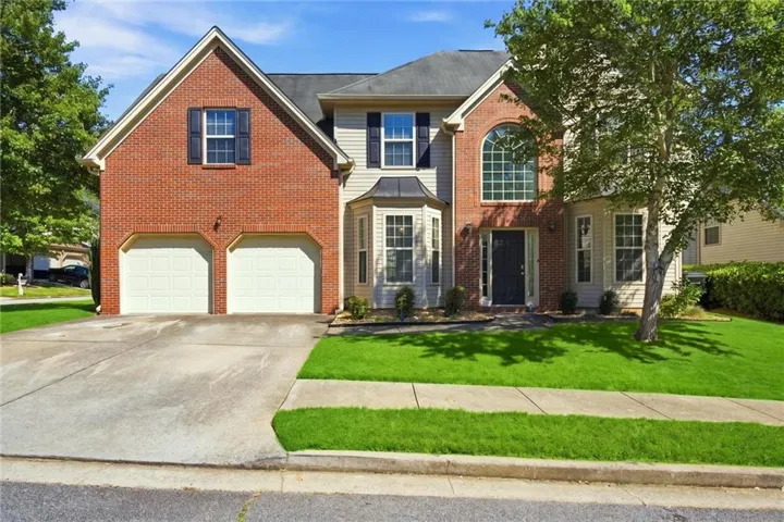 Brick and siding exterior with a two-car garage