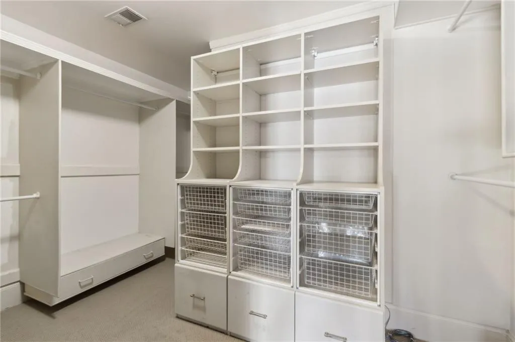 Dual Custom closets in the Primary Bedroom