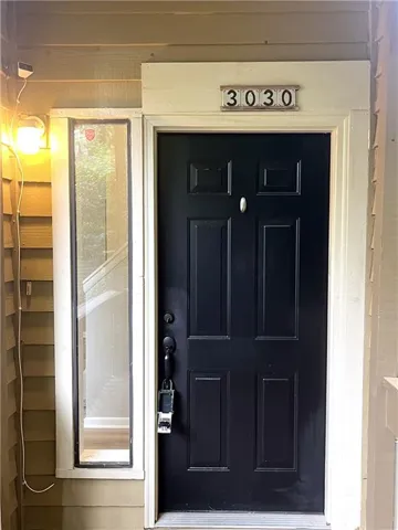 Solid paneled entry door with sidelight window