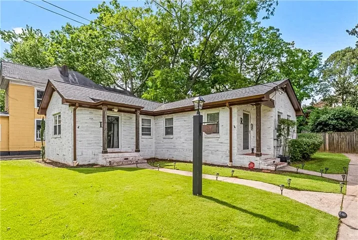 View of front of home featuring brick siding