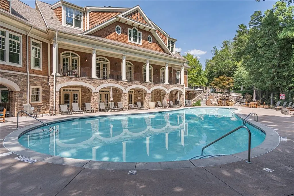 View of pool with a patio area and french doors